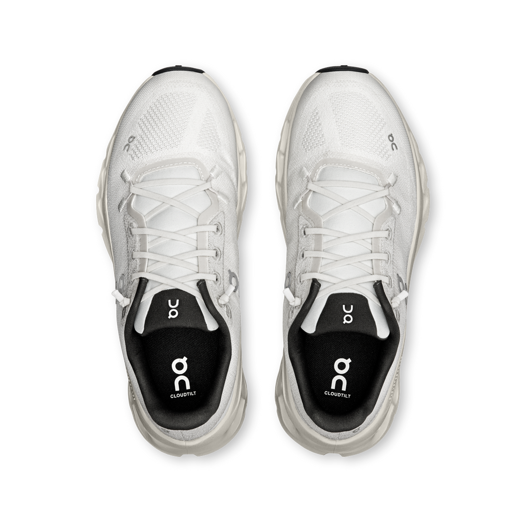 Pair of women's running shoes with white laces and black padded collars