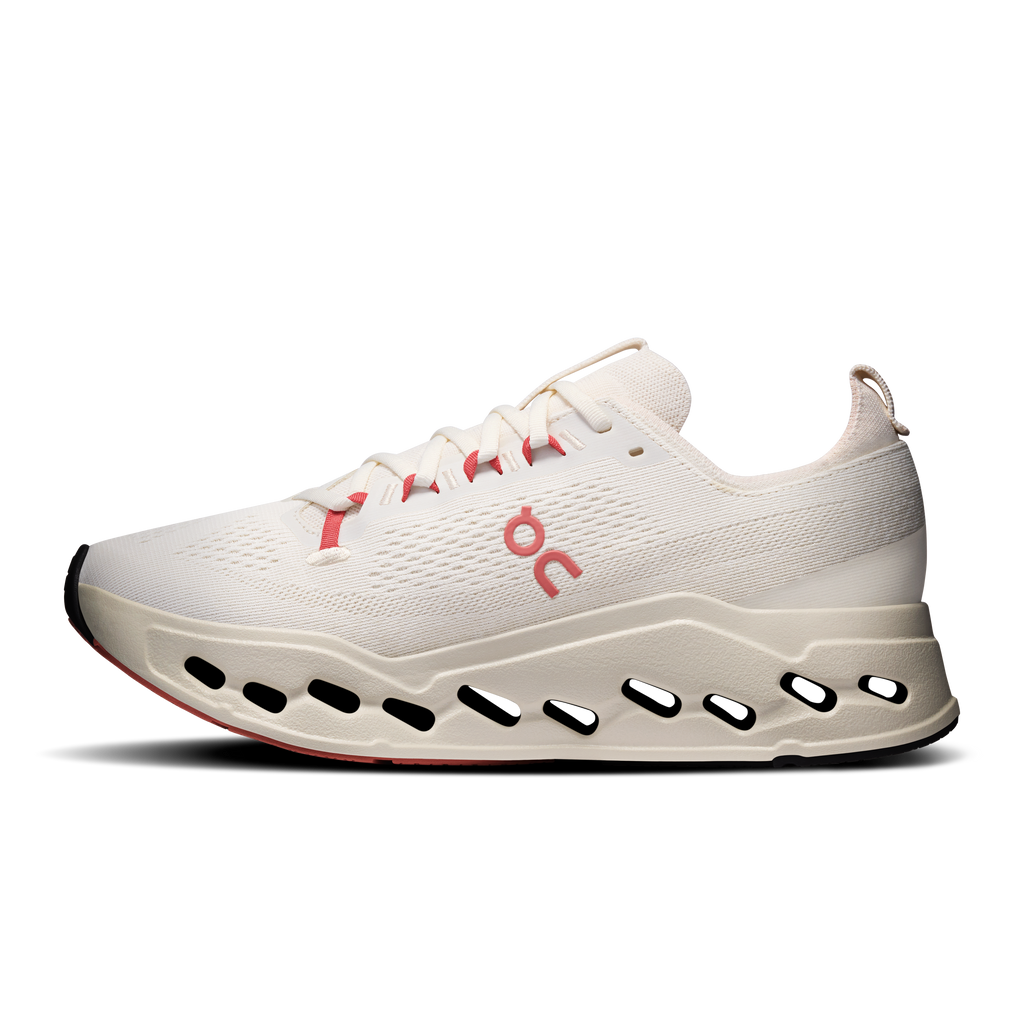 On Cloudsurfer Max running shoes, ivory knit with red logo and black oval outsole cutouts