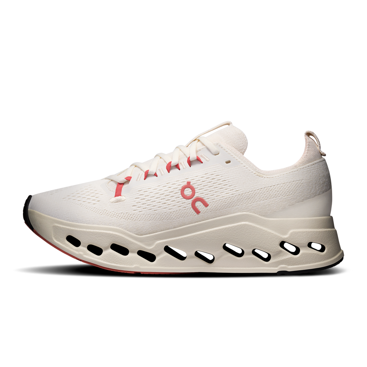 On Cloudsurfer Max running shoes, ivory knit with red logo and black oval outsole cutouts