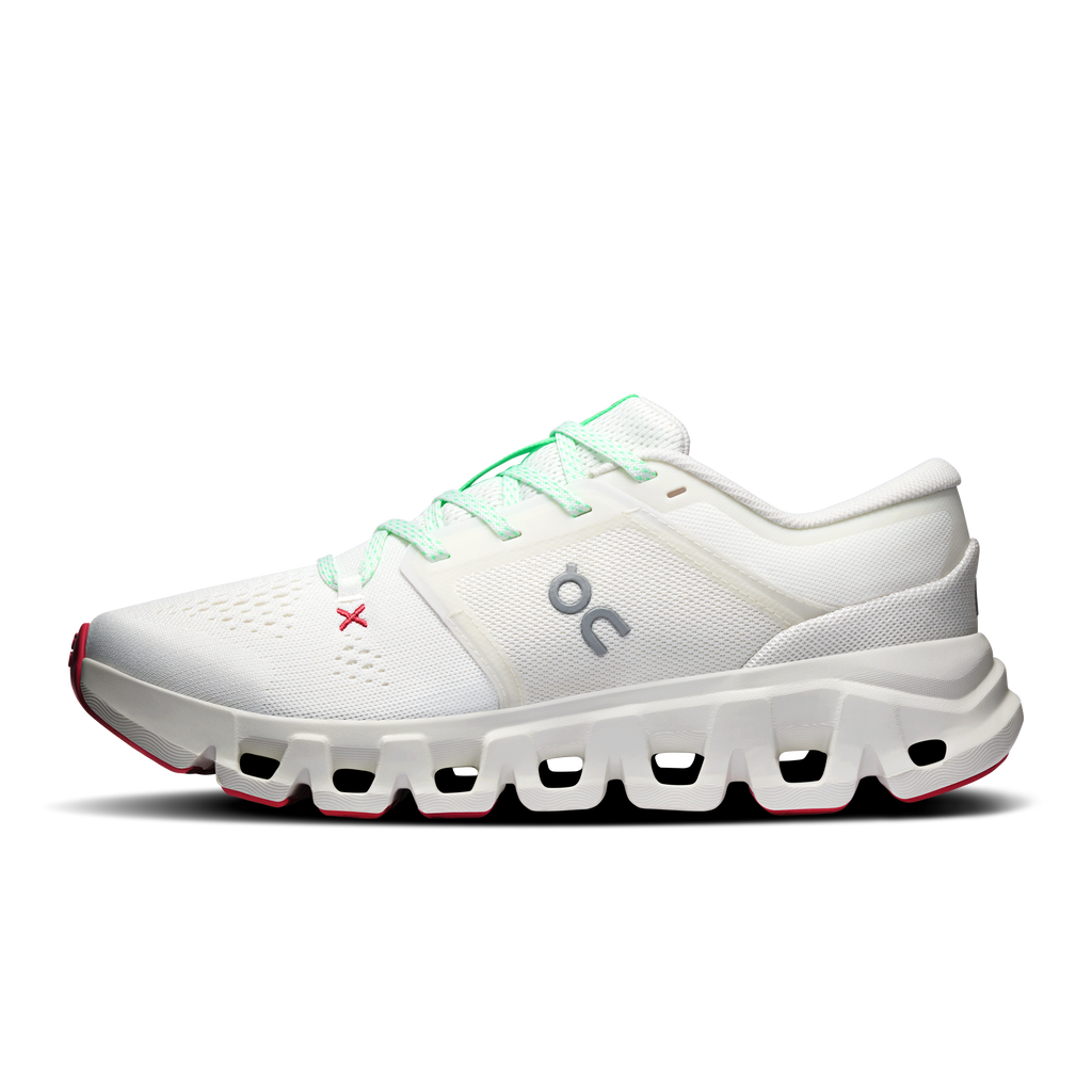 Women's ivory running shoe with mint-green laces and thick white CloudTec sole