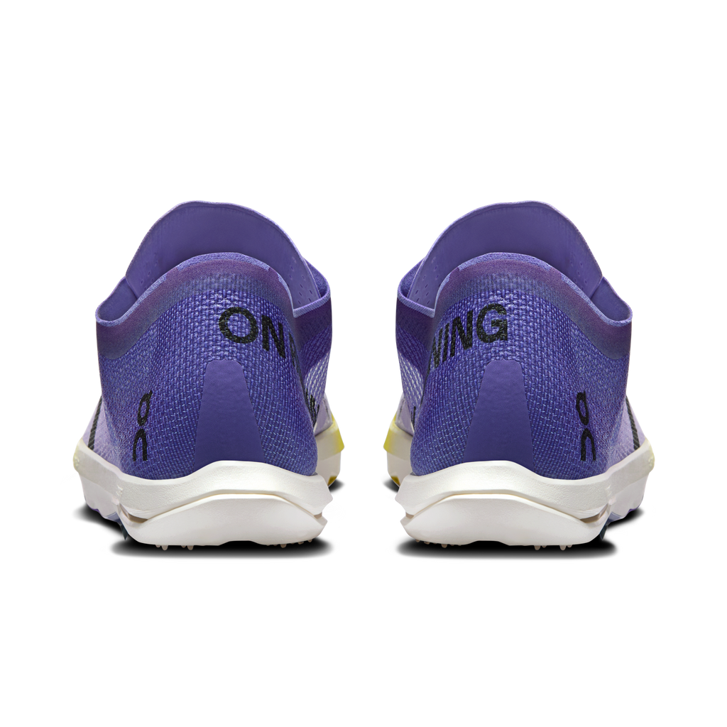 Men's running shoes with purple heel, white midsole, lime accent detail