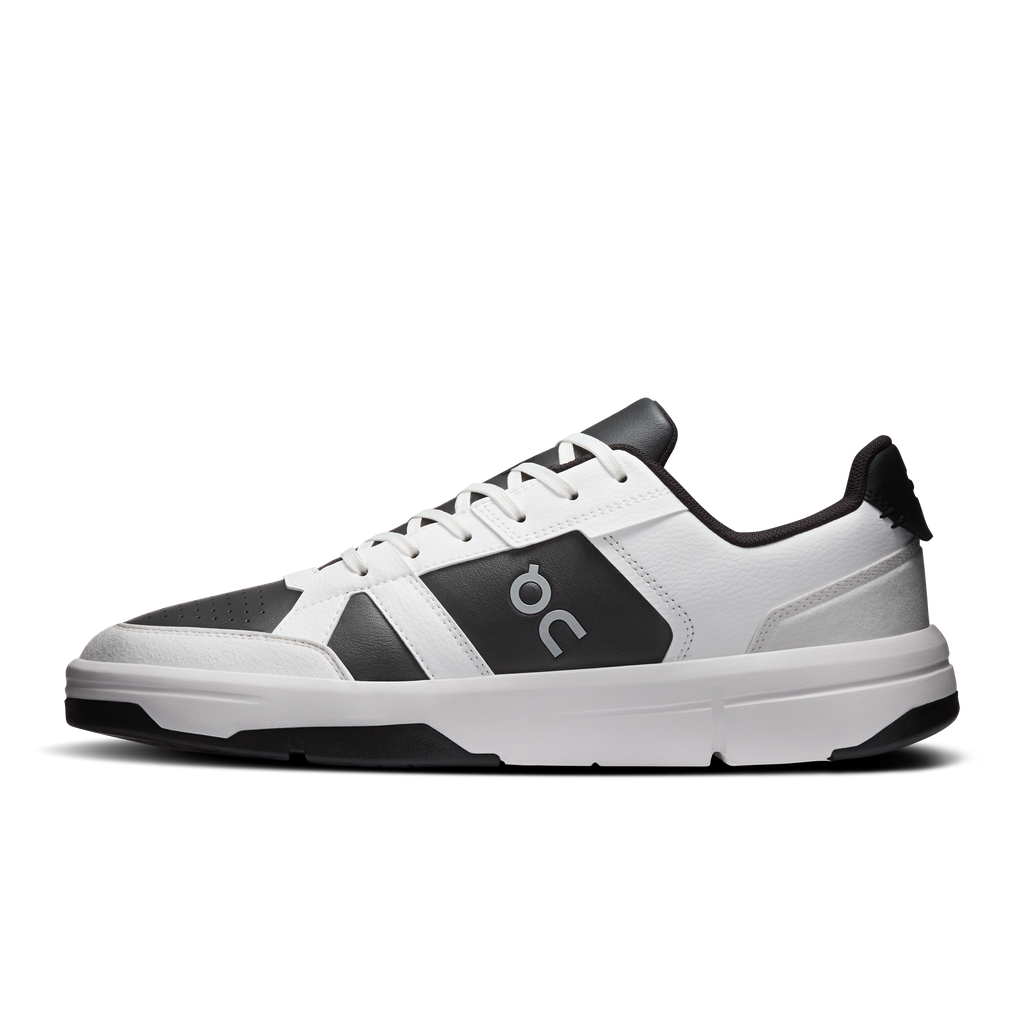 Men's white and black low-top sneakers with lace-up front and contrast side panel