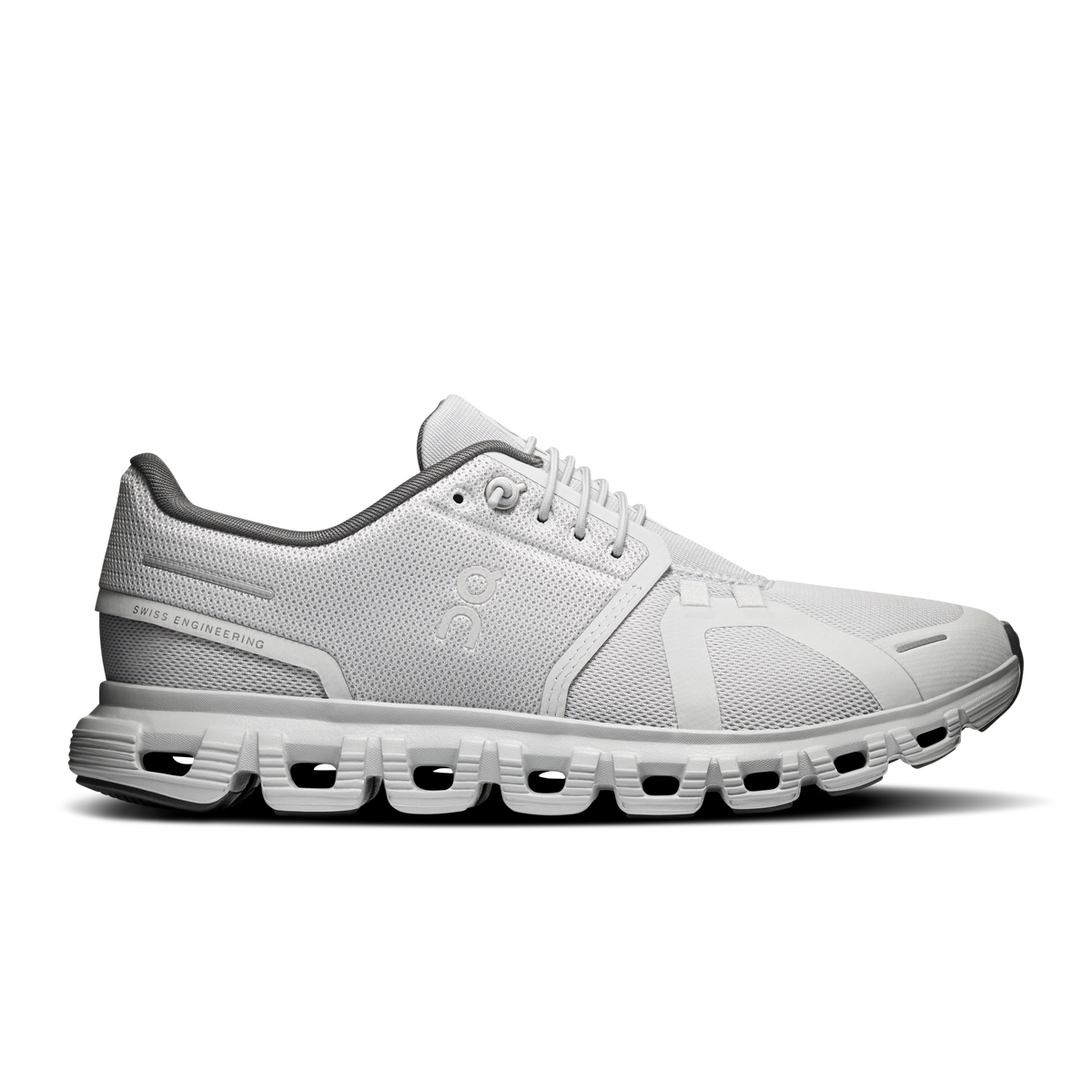 Women’s On Cloud 6 running shoes in light gray with black accents, side view