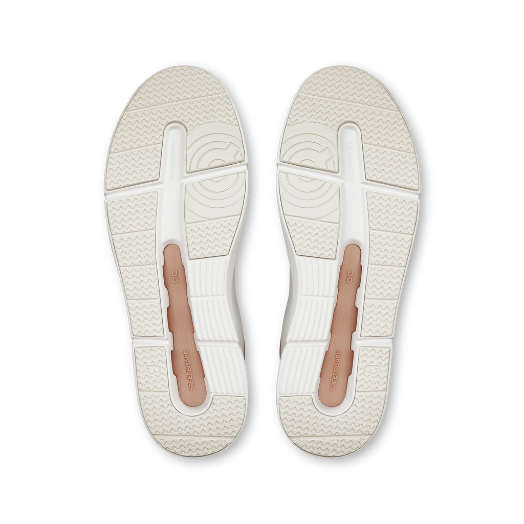 Pair of women's On shoe outsoles with textured tread and light rose inserts