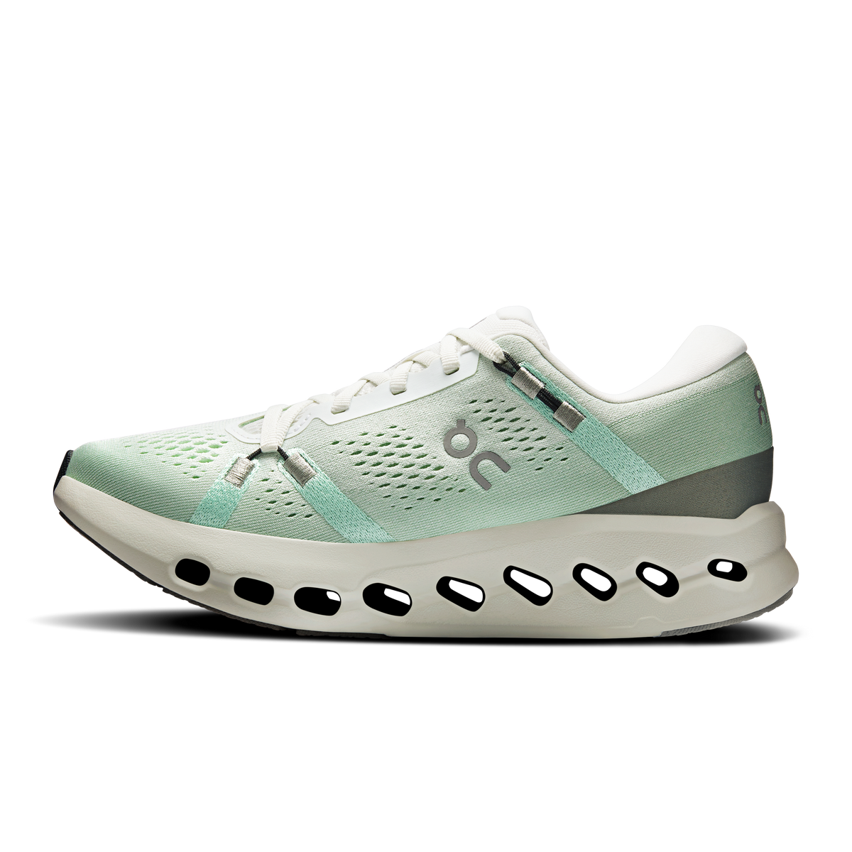 Women’s running shoe with mint mesh upper, ivory laces, and CloudTec outsole