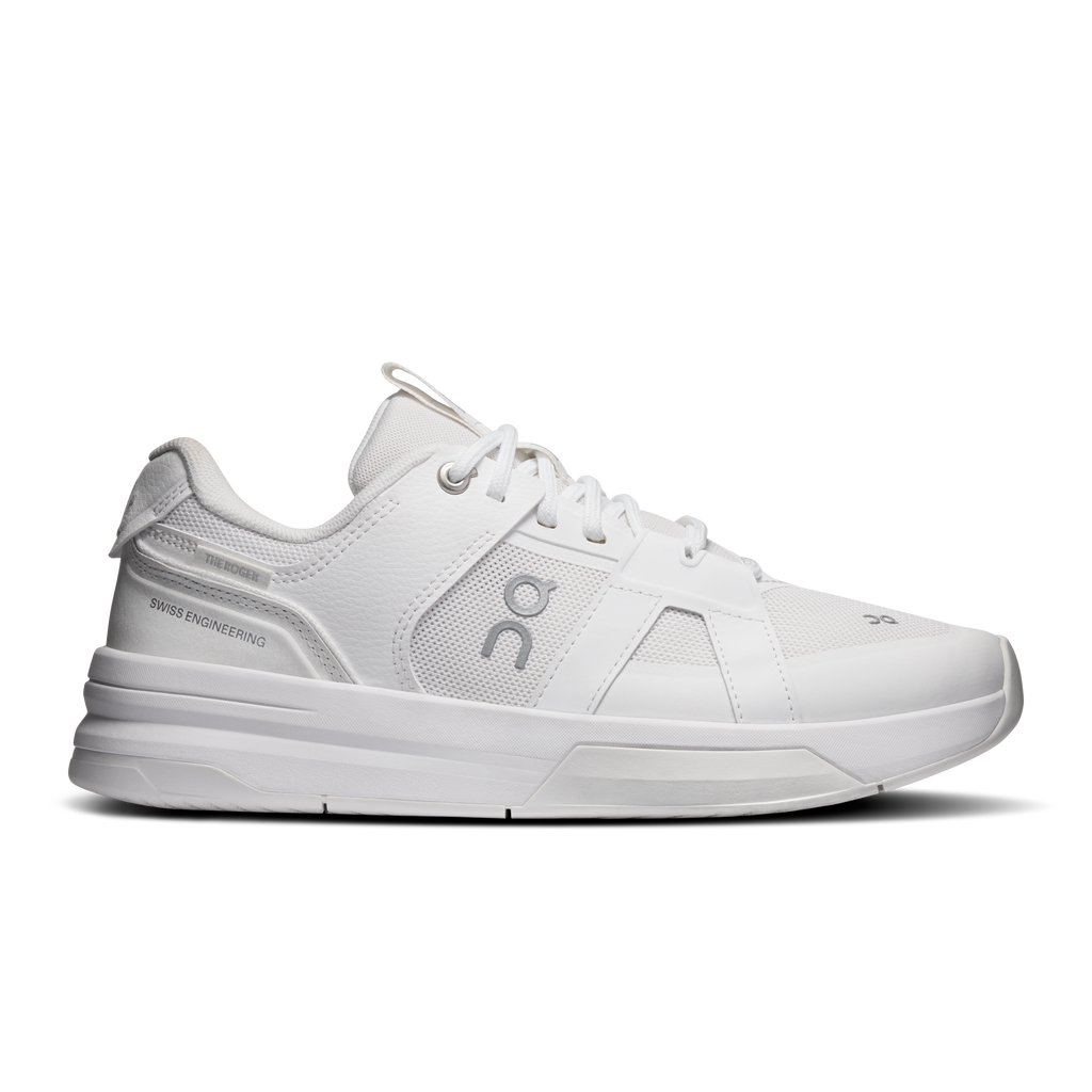 On women's running shoes in white with lace-up front and side logo details
