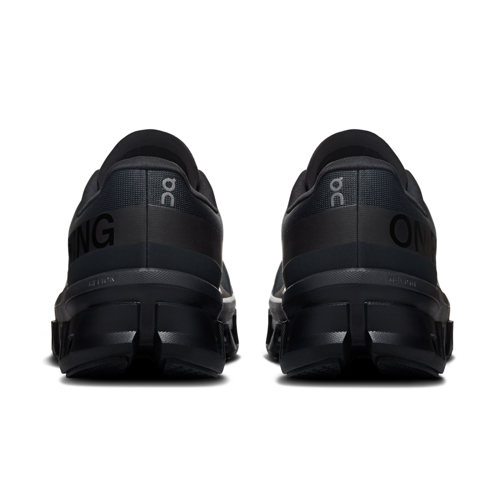 Men's black running shoes rear view with heel cushioning and lace-back detail
