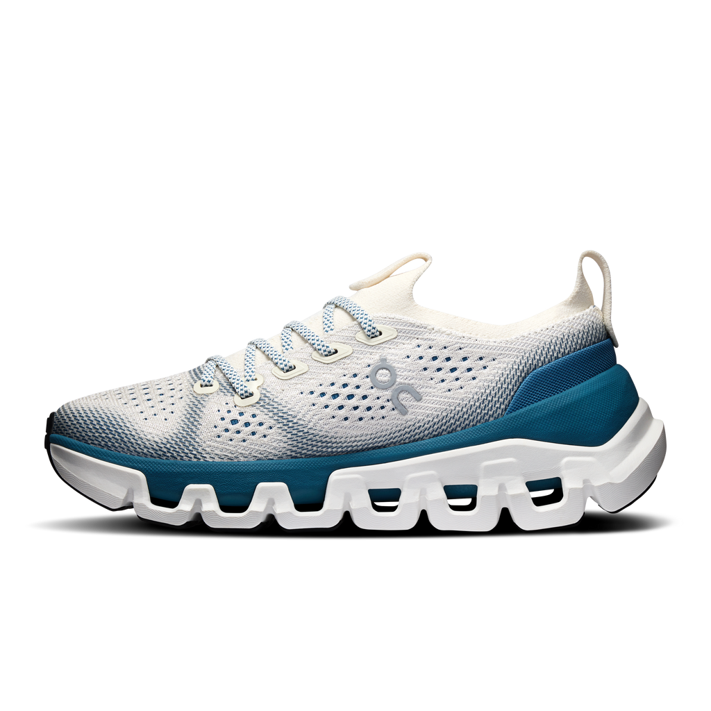 Women’s running shoes, white mesh upper with blue side stripe and cushioned sole