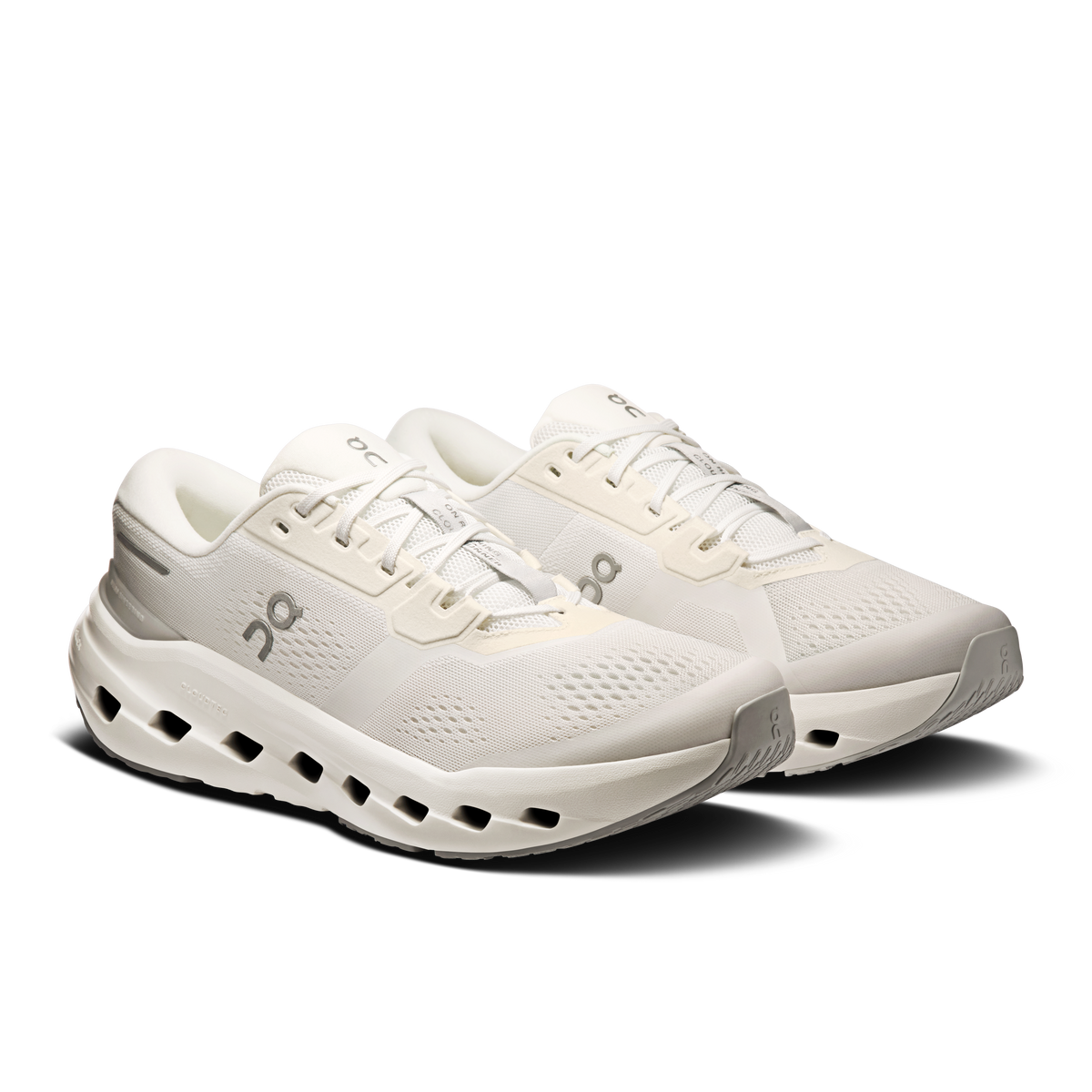 Men's white running sneakers, two-quarter view, lace-up and cushioned sole pods