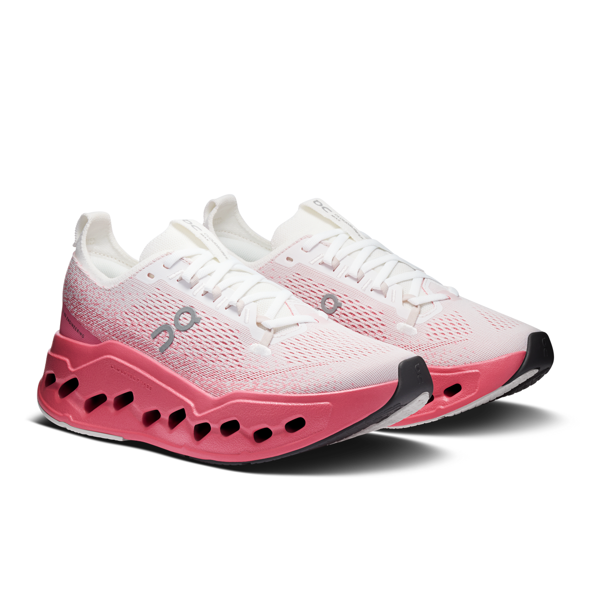Women's running shoes, white knit upper with pink outsole and lace-up front