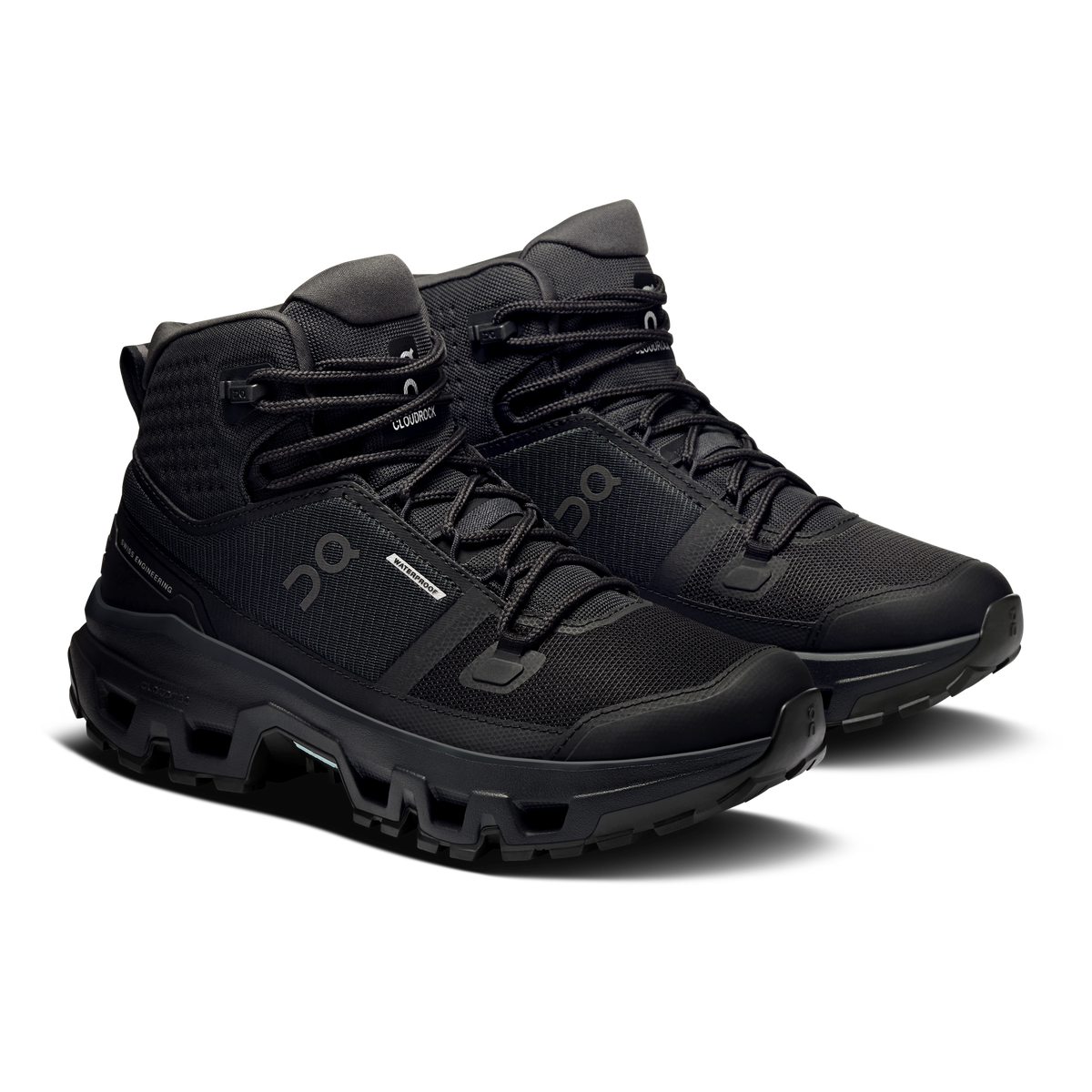 Black mid waterproof hiking shoes with lace-up closure and rugged tread sole