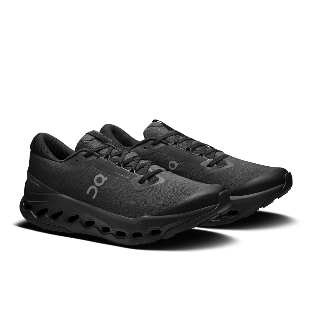 Men's black waterproof trail running shoes, front 3/4 view, lace-up with On logo