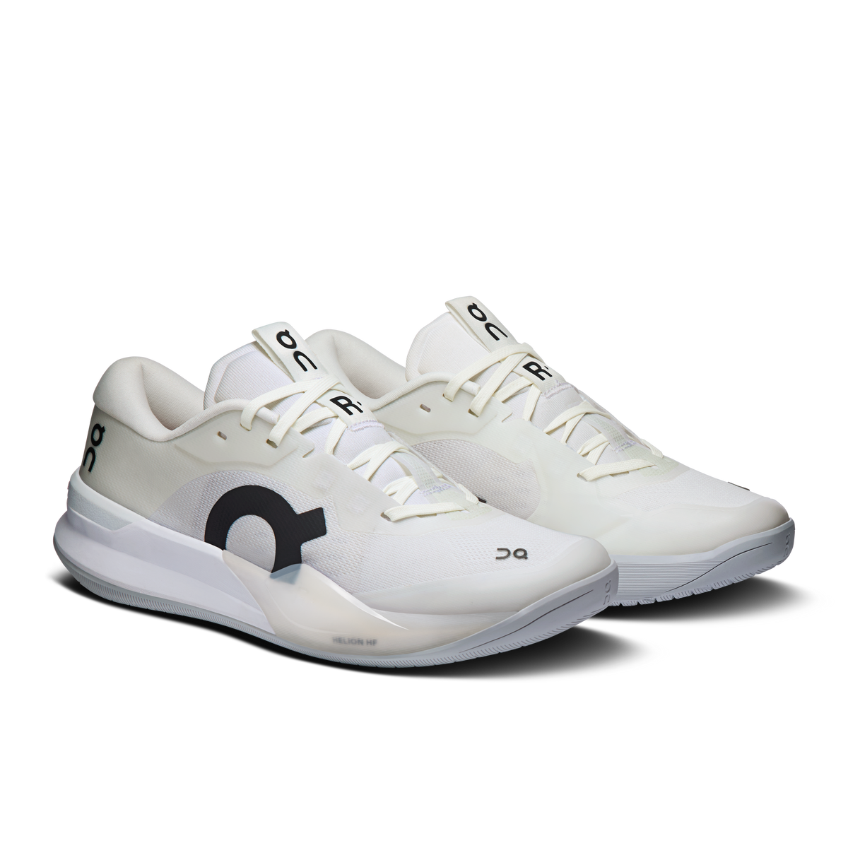 White women's running shoes with lace-up front and black logo, cushioned gray sole