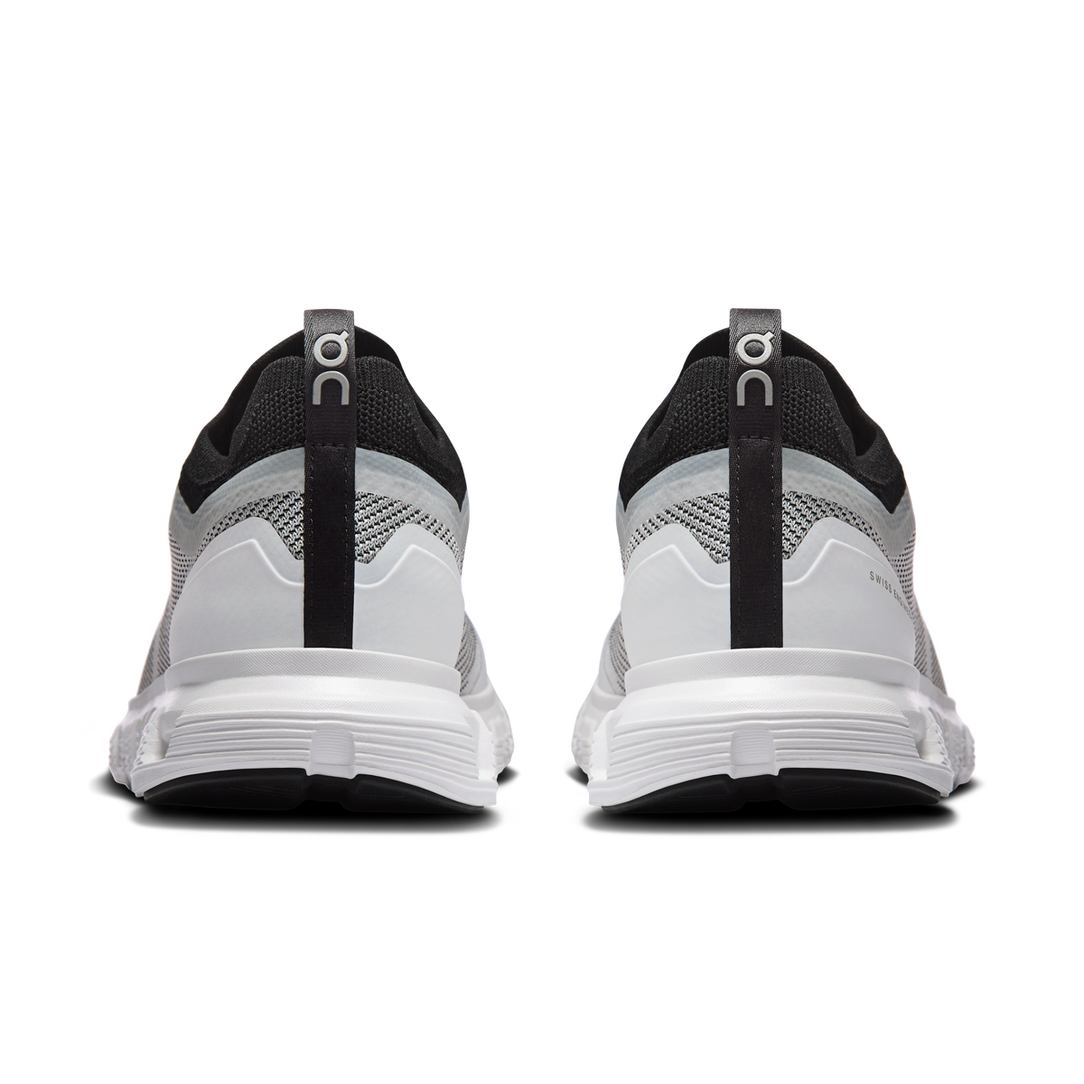 Women’s white/black running sneakers, rear view with pull tab and molded heel
