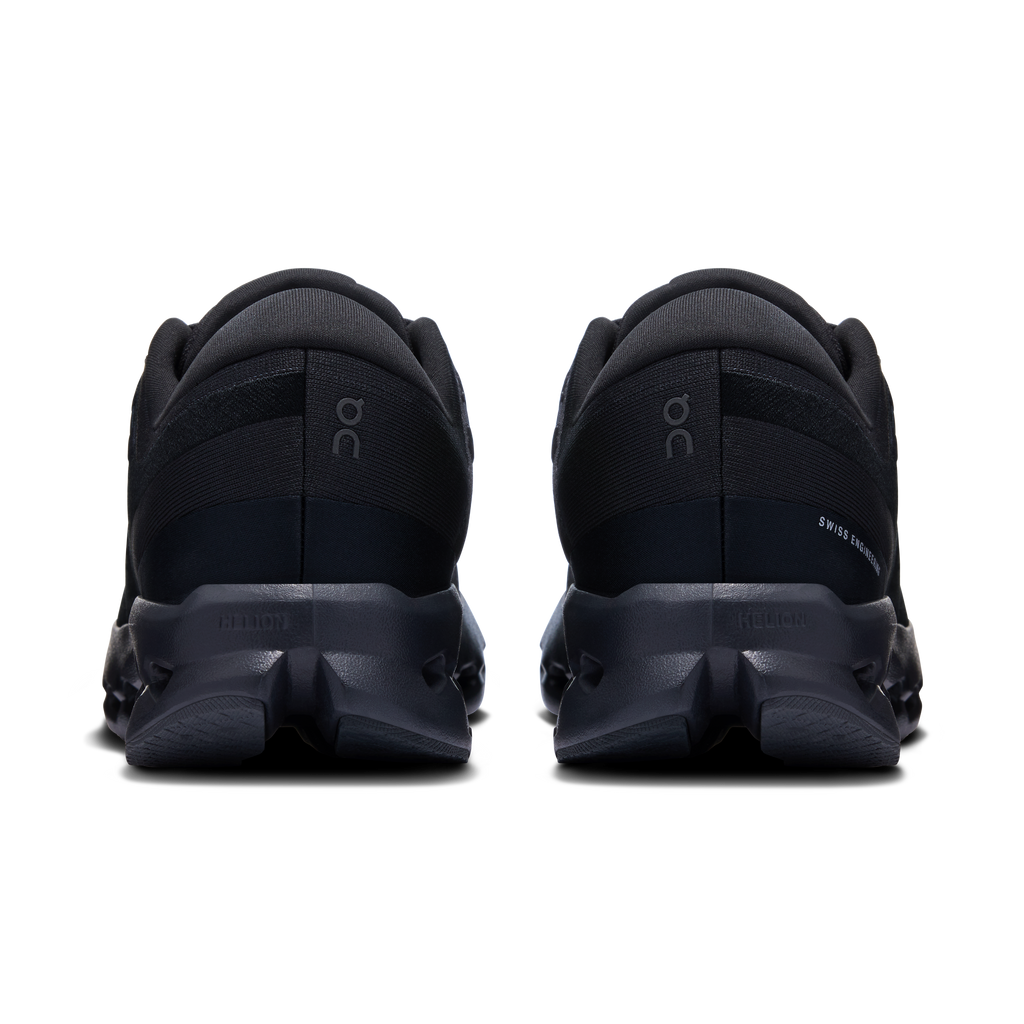 Women's wide black running shoes, rear view with cushioned heel collar
