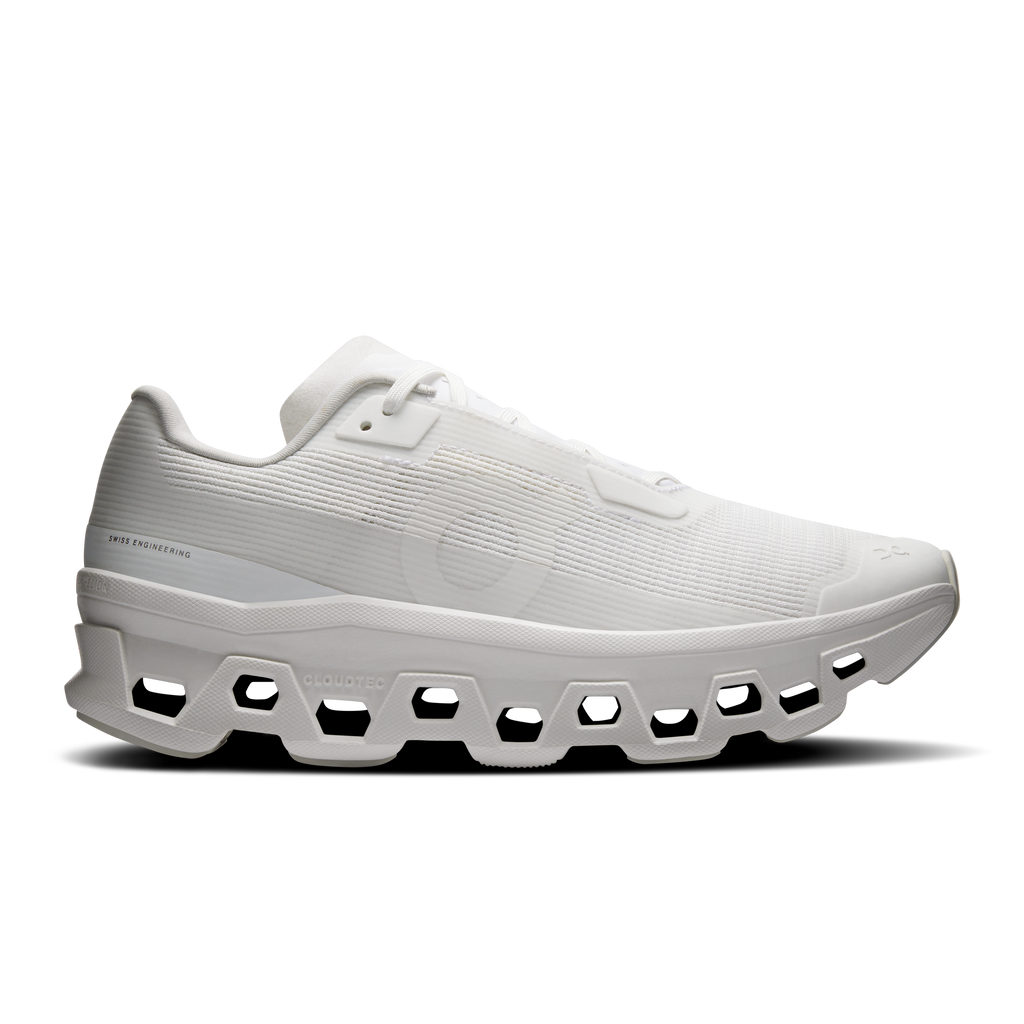 Women's white running shoes with textured mesh upper and strap lacing