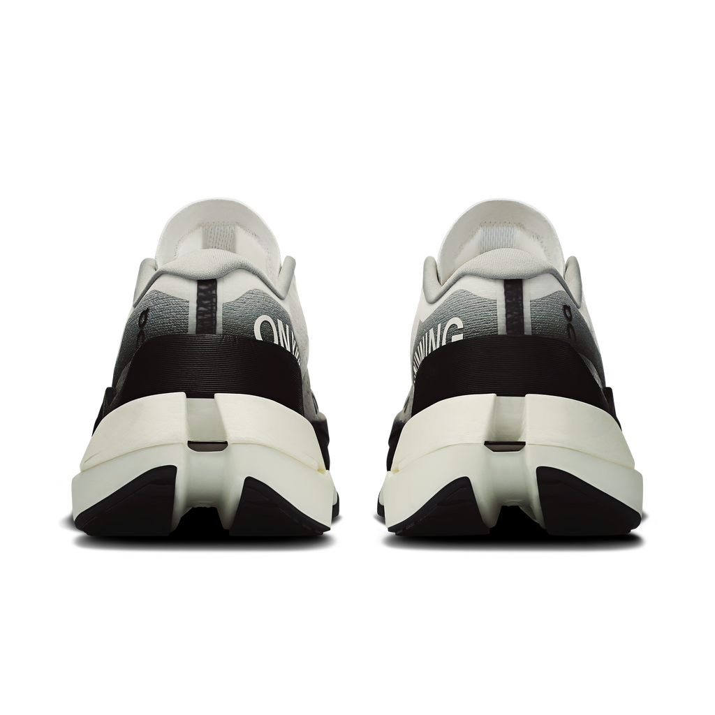 Women's On Cloudboom Max heel view with white upper, black collar, and cushioned midsole
