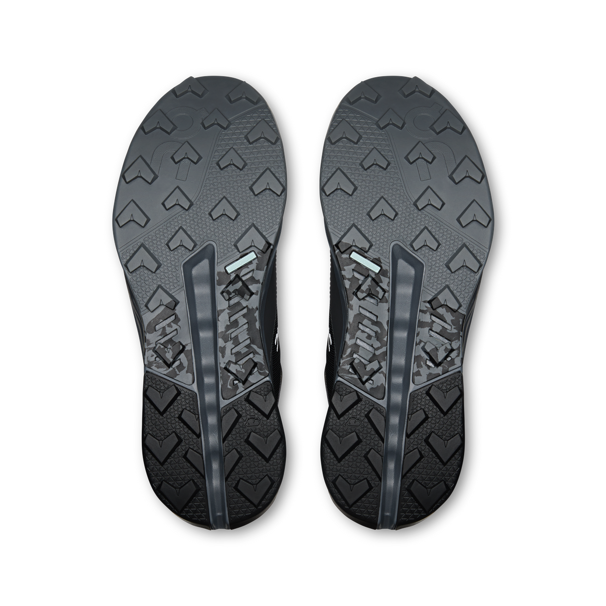 Men's waterproof mid hiking shoe outsoles by On, textured tread with arrow pattern