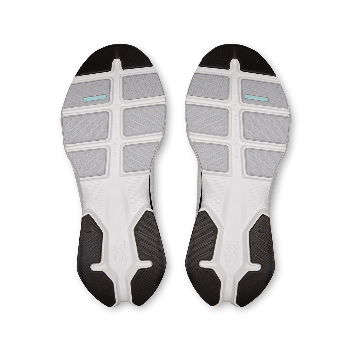 Men's shoe outsoles, white tread with dark rubber sections and teal accents