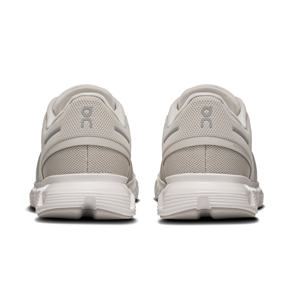 Women's pearl and white sneakers, rear view with cushioned heel and pull tab.