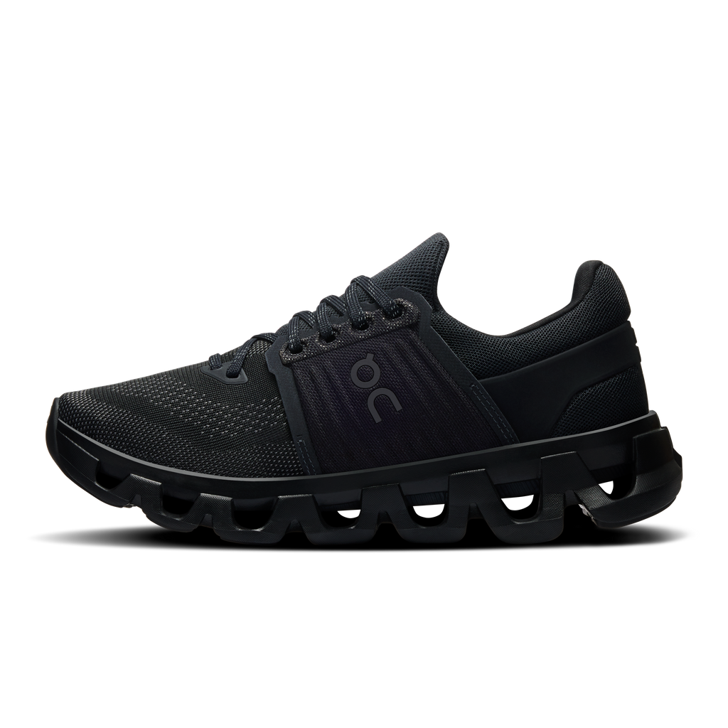 Women's black lace-up running shoes with textured mesh upper and cushioned midsole