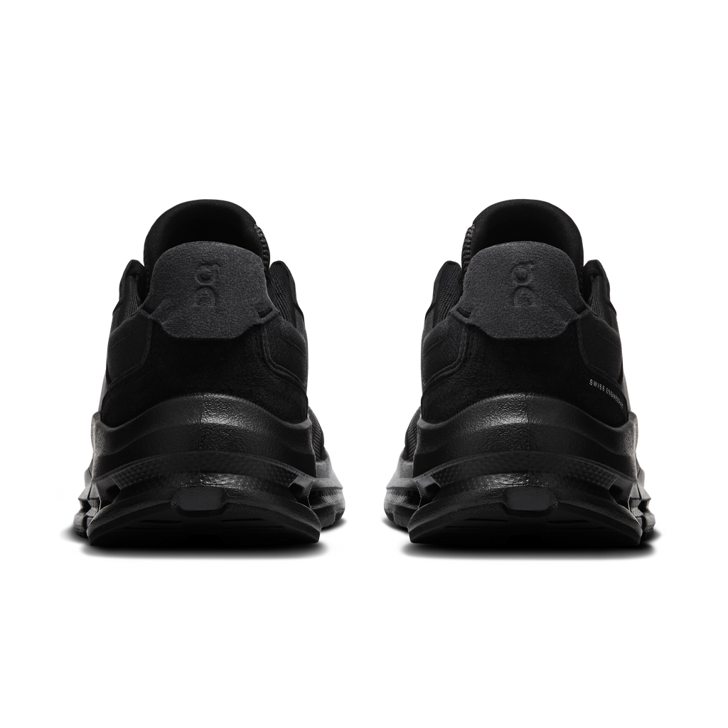 Men's black running shoes rear view with cushioned heel and pull tabs