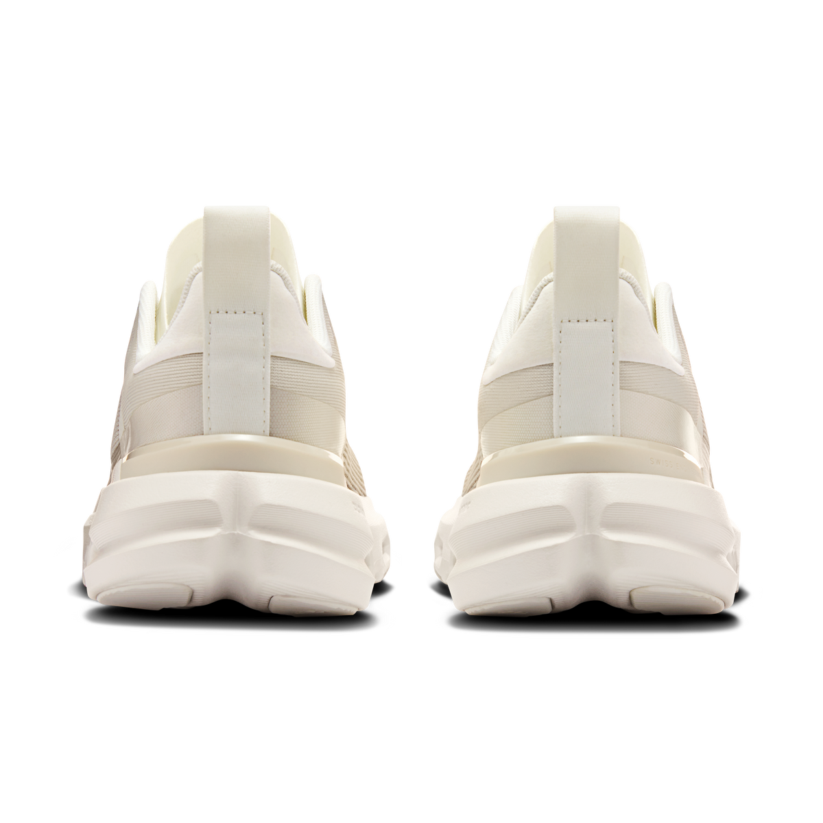Women’s white heel view of lace-up running sneakers with padded collar and cushioned sole