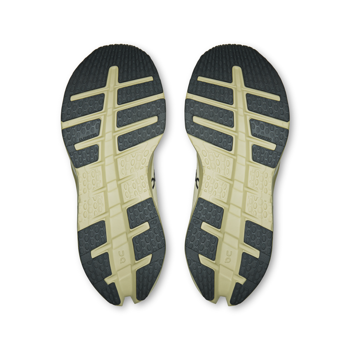 Women's waterproof running shoe outsoles with textured traction tread, dark gray and pale yellow.