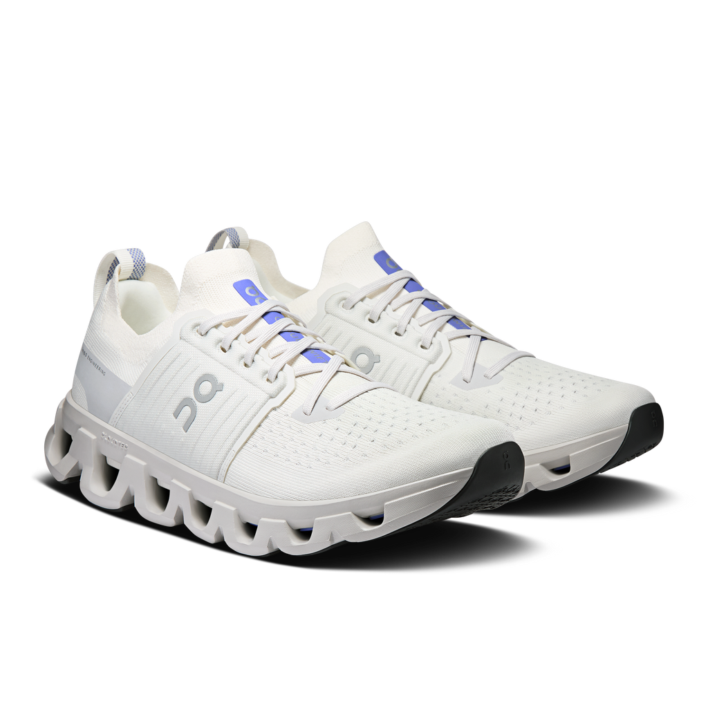 Ivory men's running shoes, lace-up front with blue logo accents and CloudTec sole