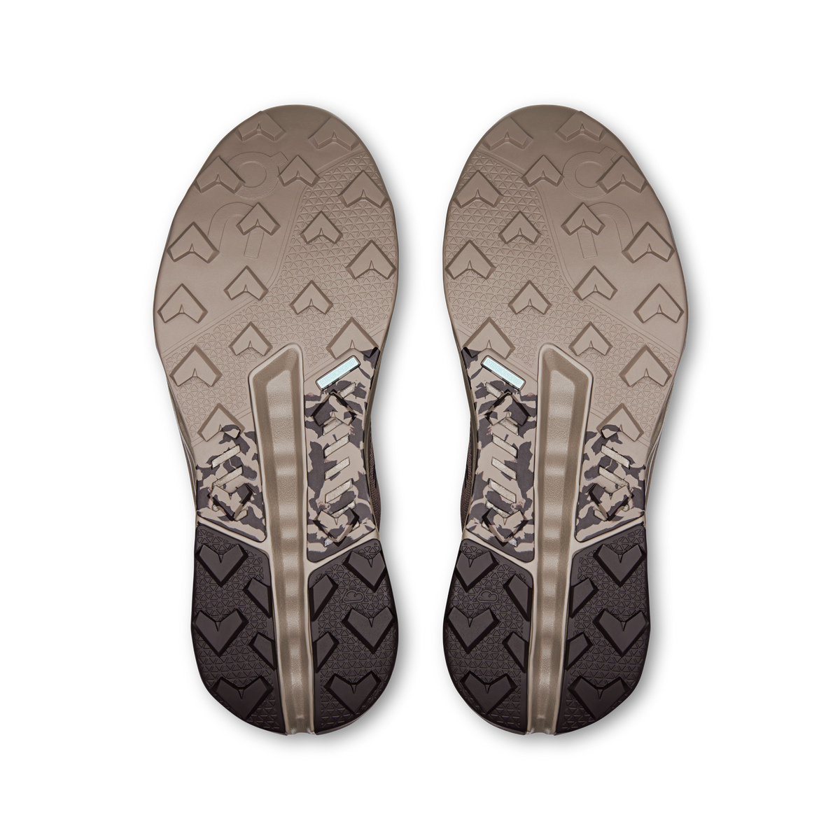 Pair of outsoles with patterned tread and metallic side stripes.