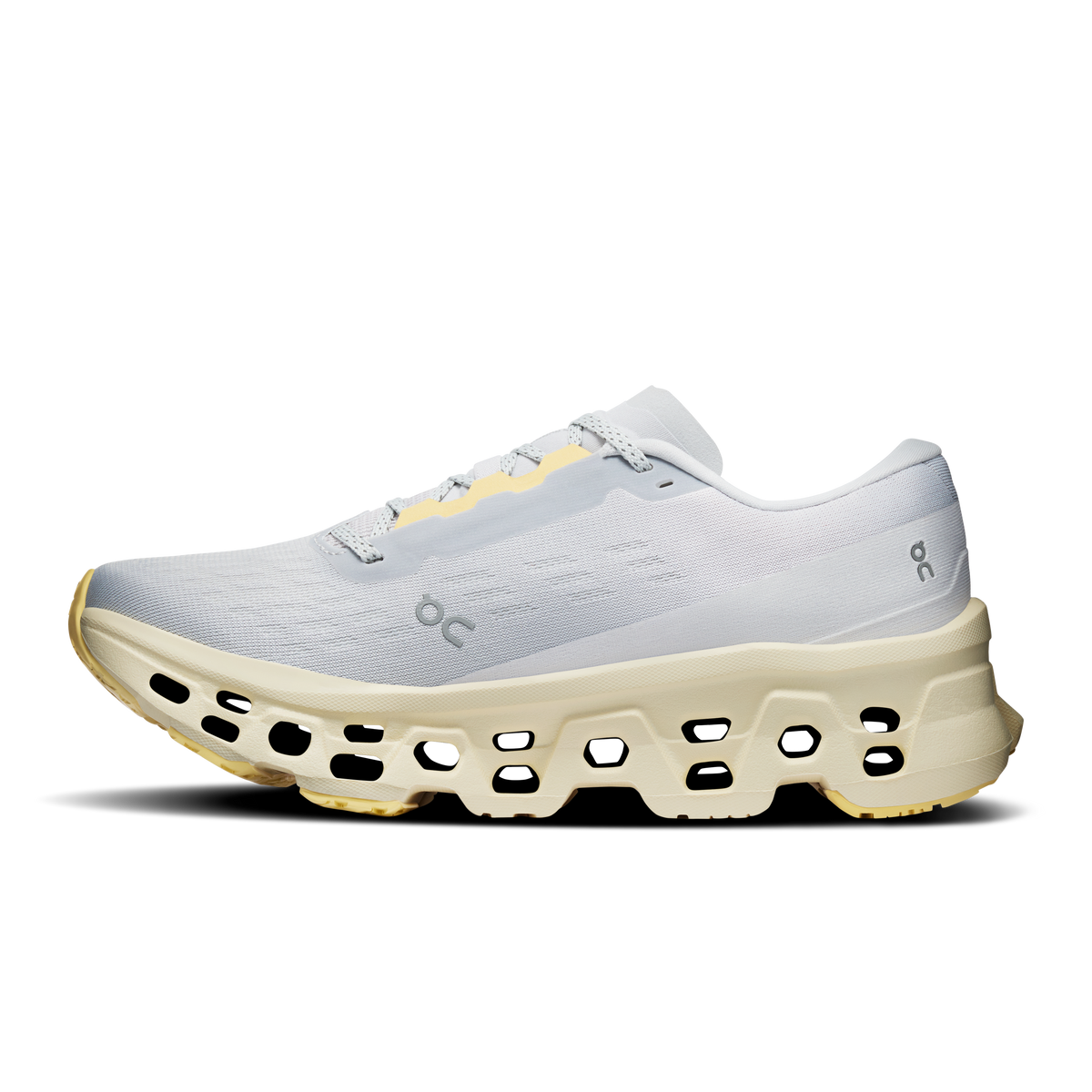 Light gray On running shoe with white laces and chunky yellow platform sole