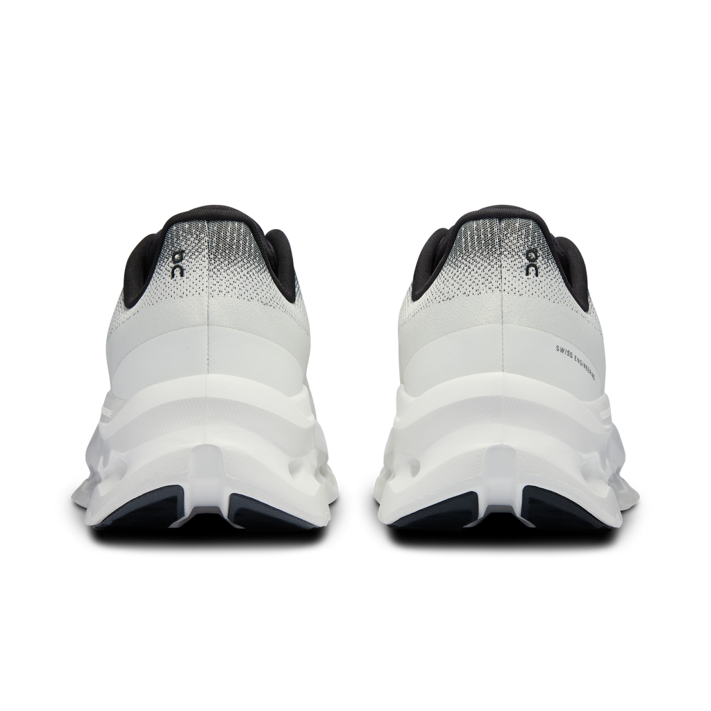 Cloudtilt running shoes with black heel trim and light gray knit on white sole