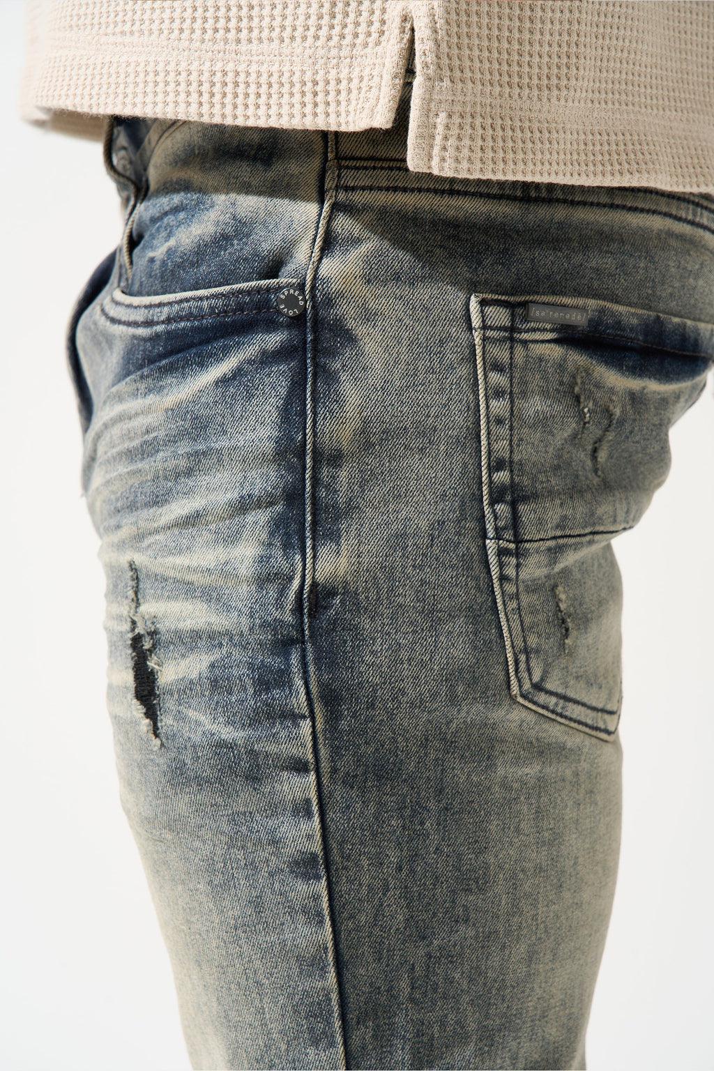 Men's gunmetal jeans with front patch pocket, belt loops, and faded wash