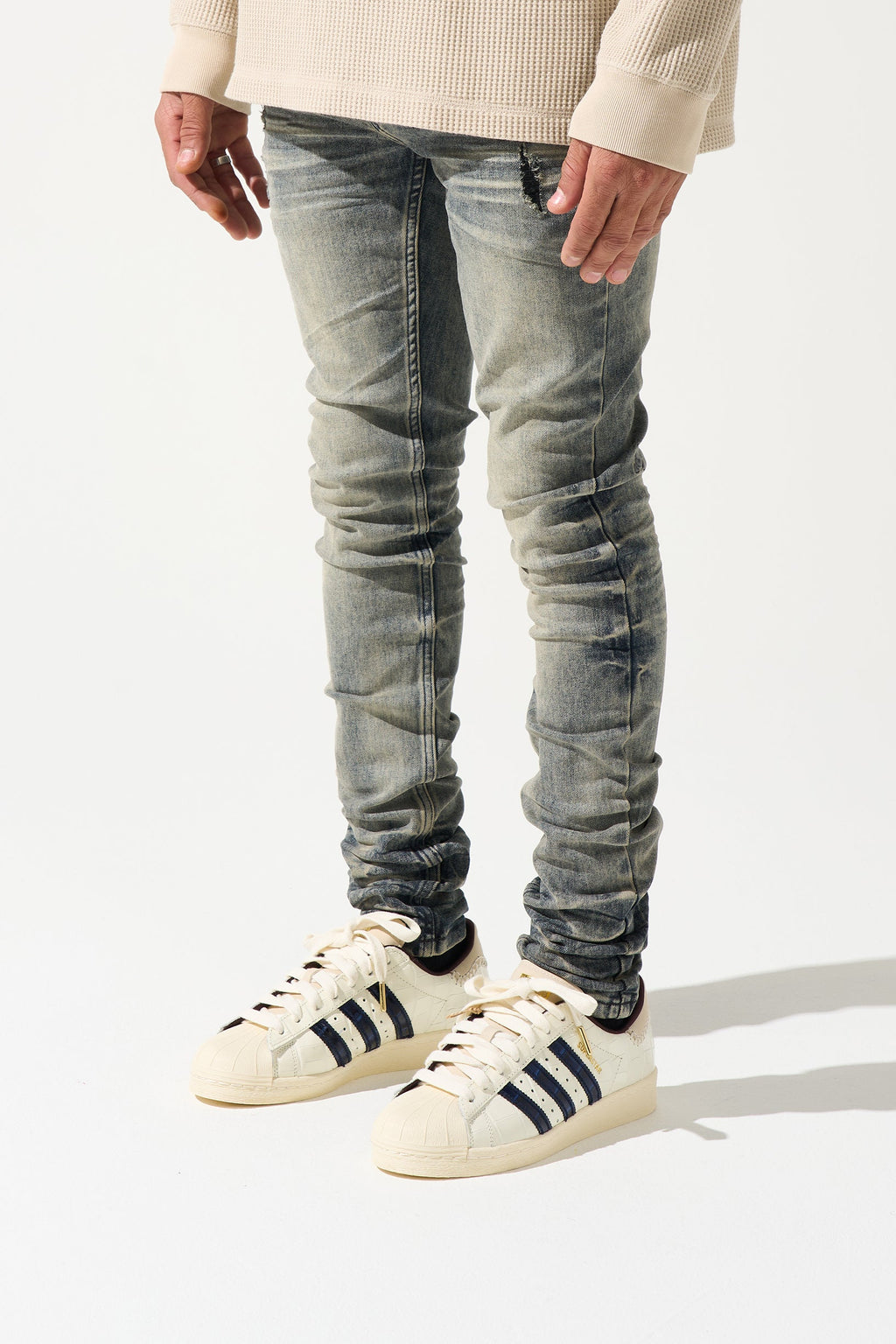 Men's gunmetal-wash slim jeans, front view, distressed fading and ruched ankle cuffs