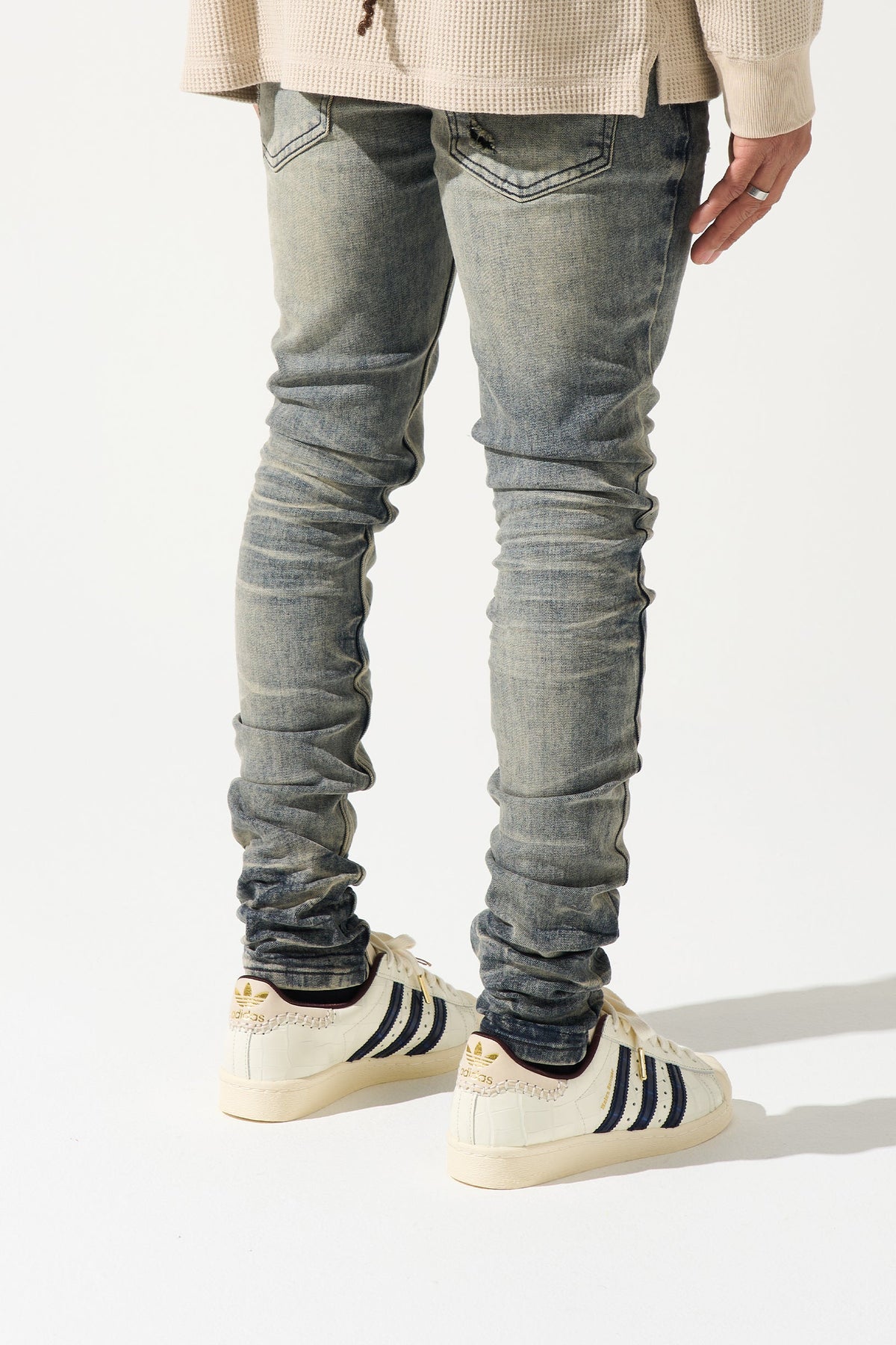 Men's gunmetal-wash slim jeans, side view, ruched ankle cuffs and worn wash