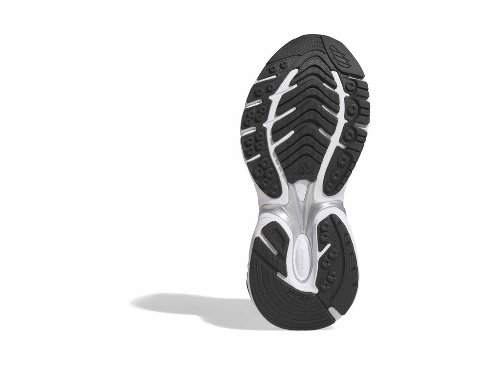 Women’s running shoe outsole with tread, white and black rubber underside