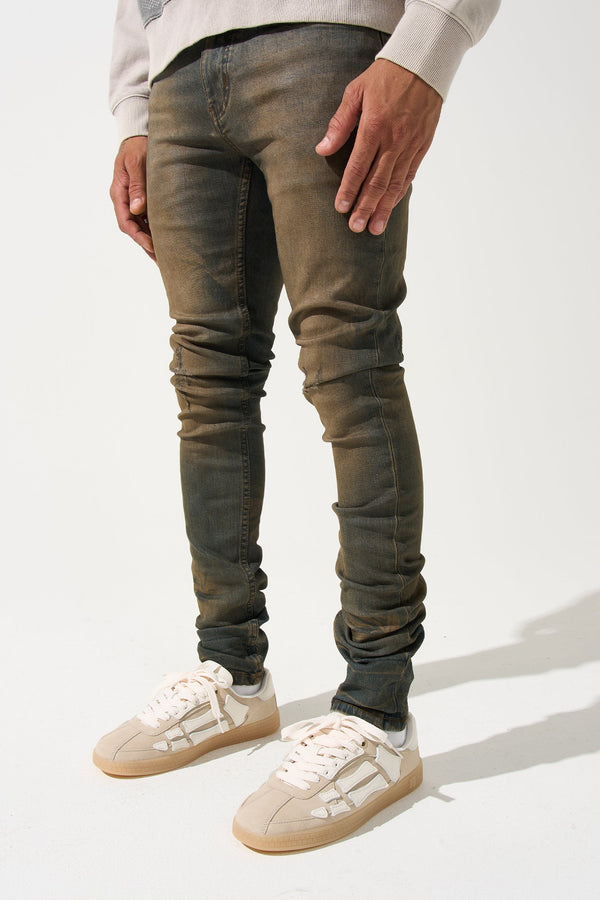 Earth-brown men's slim jeans with ruched knees, five-pocket design.