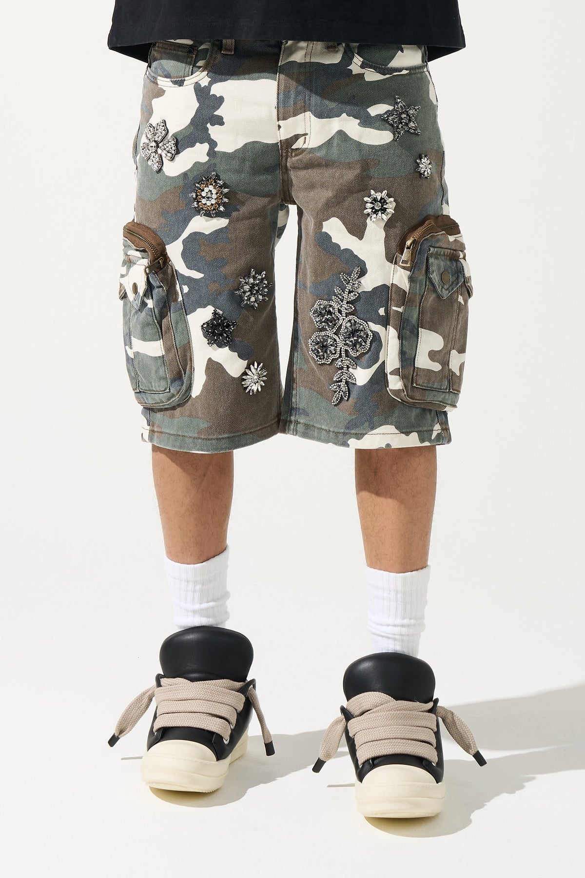 Men's camo cargo shorts with multiple utility pockets and white-blue floral embellishments