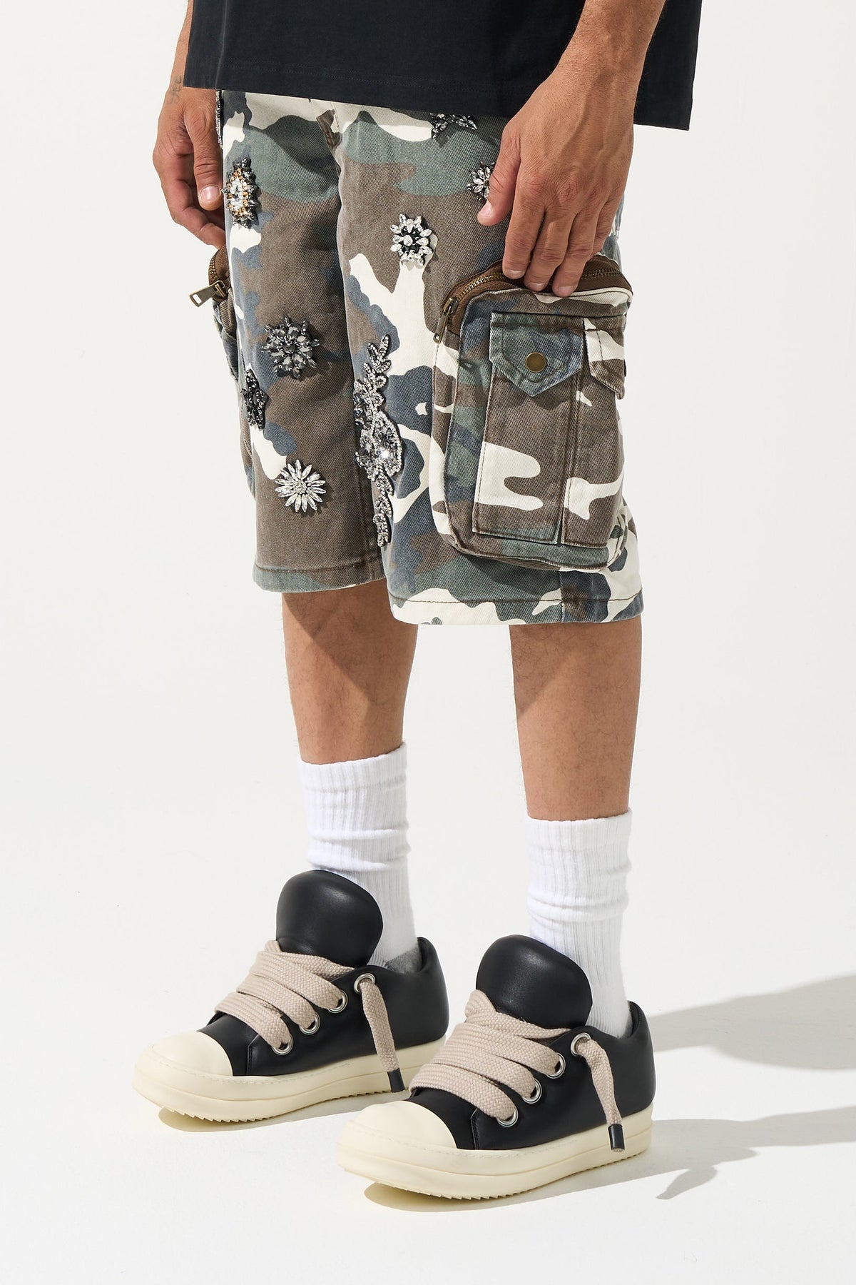 Men's camo cargo shorts with front cargo pockets and decorative flower patches