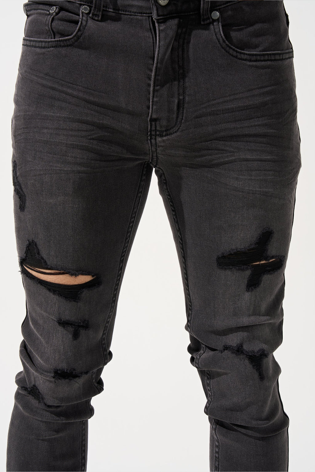 Men's charcoal jeans close-up with belt loops, button fly, and thigh rips