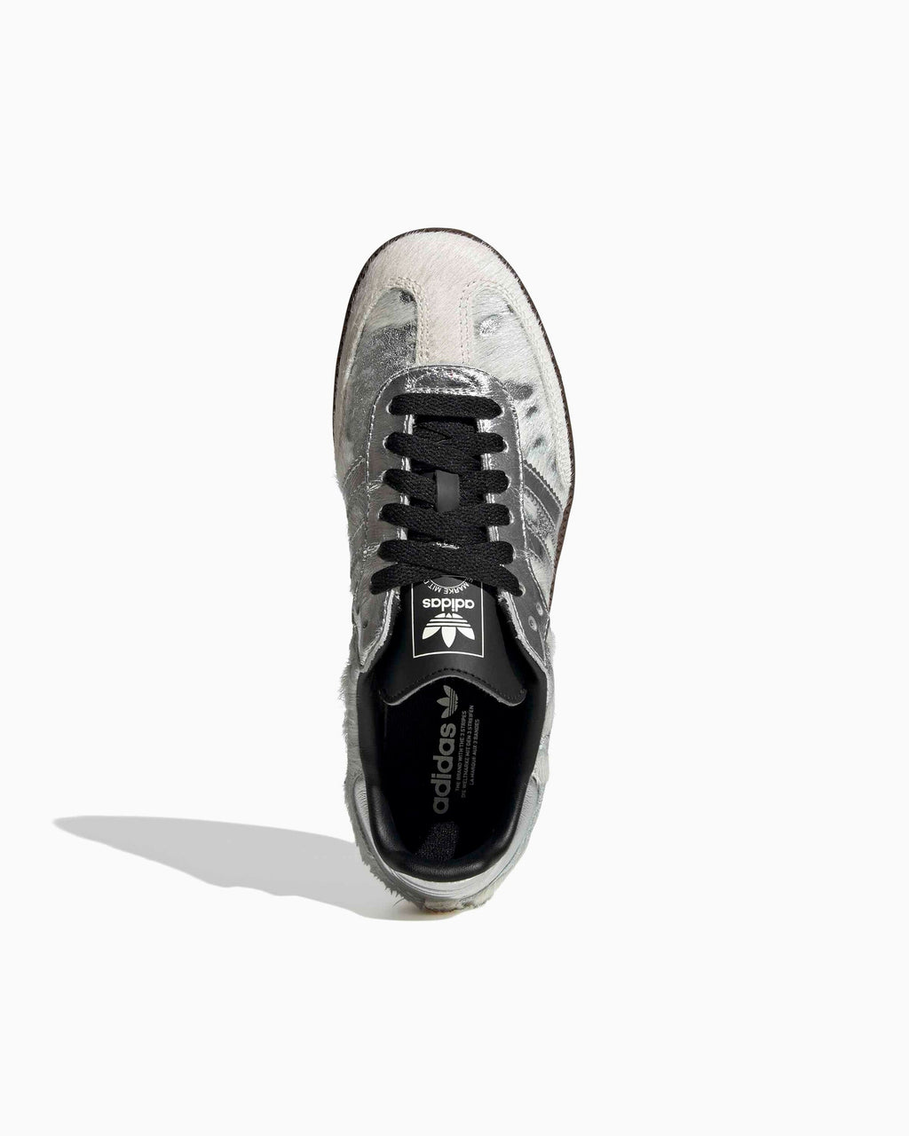 Adidas Samba OG toe view: silver pony-hair upper with black lace panel
