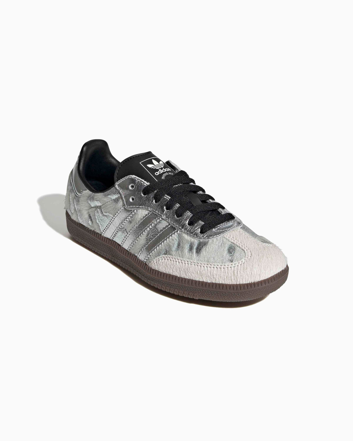 Adidas Samba OG angled side view: metallic silver pony-hair upper, black laces