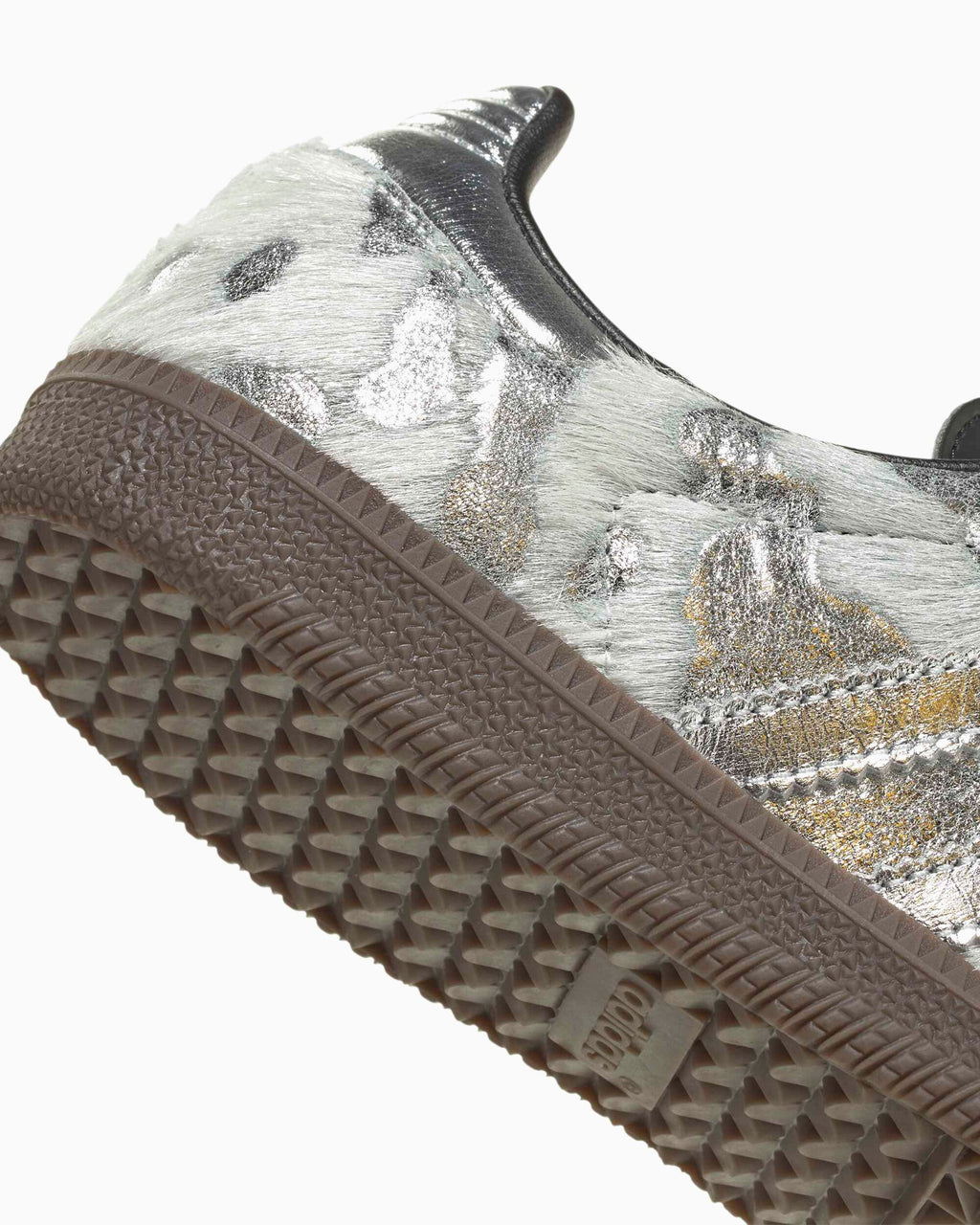 Adidas Samba OG outsole side: textured gum tread with silver pony-hair upper