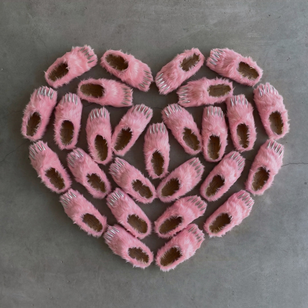Pink bear claw mules with plush upper, claw cutouts, and grippy sole