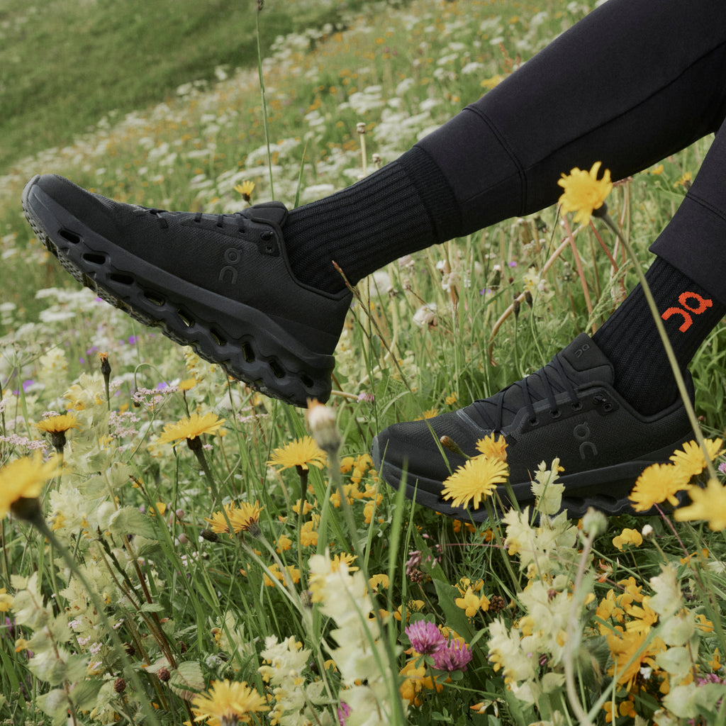 Black women's running shoes with lace-up front and cushioned tread sole