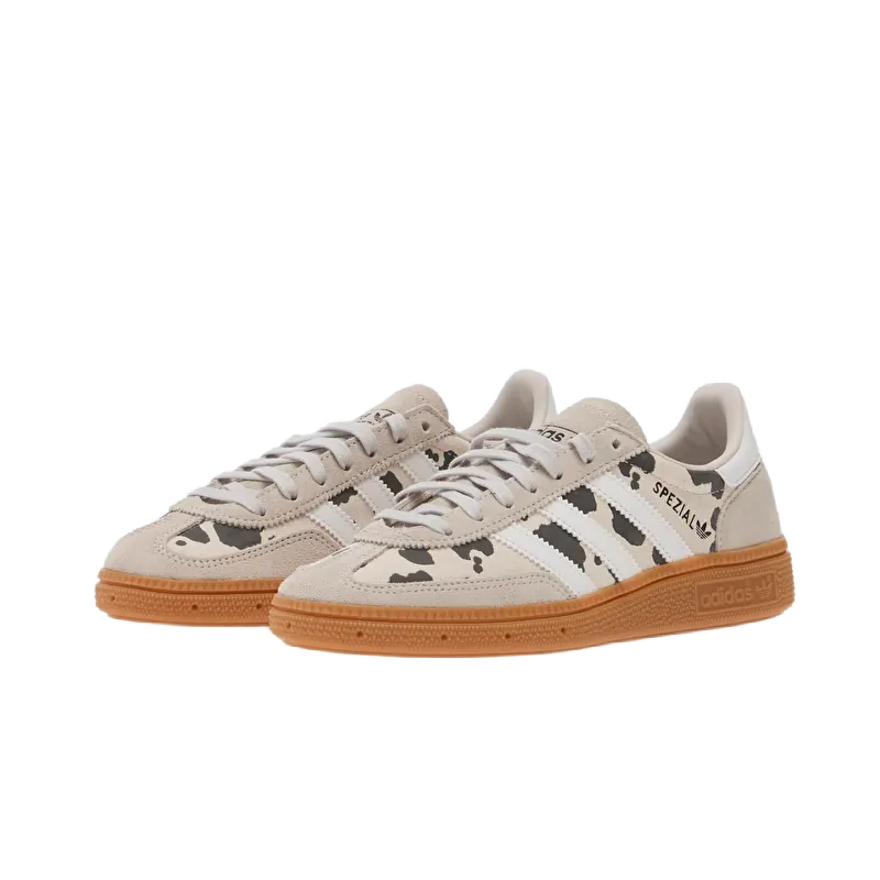 Kids' Adidas Handball Spezial sneakers pair view; grey uppers, white stripes, gum sole.