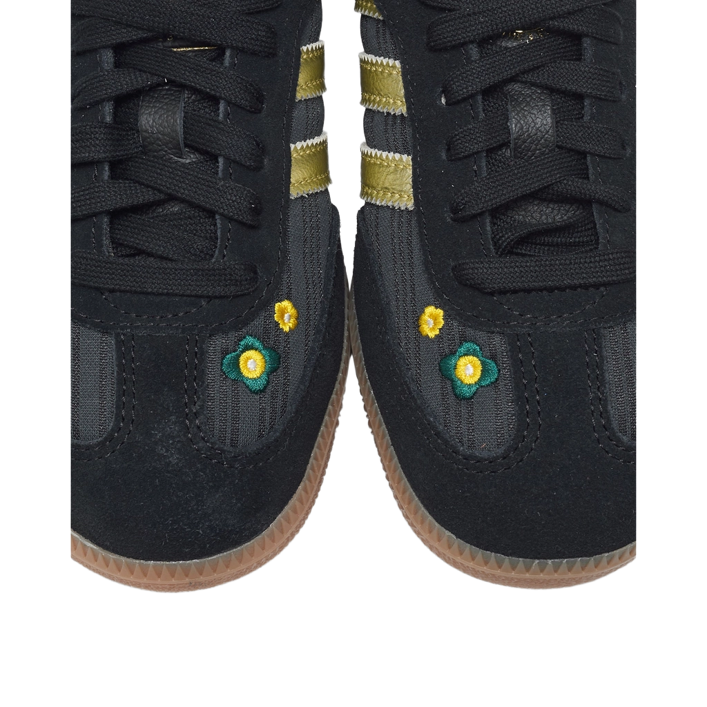 Adidas Samba OG shoes closeup, black laces with flower embroidery, gum outsole