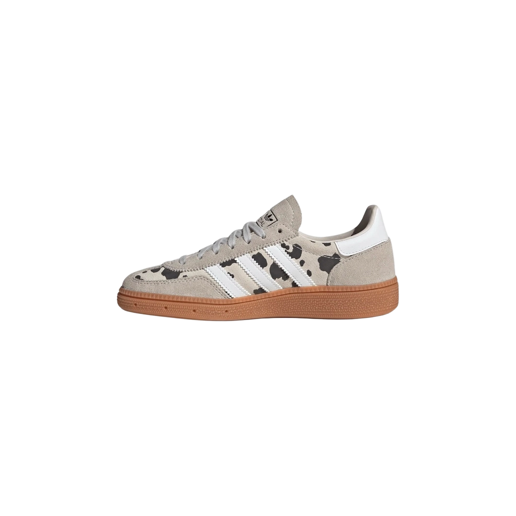 Kids' Adidas Handball Spezial sneaker, angled side view; grey with white stripes and gum sole.