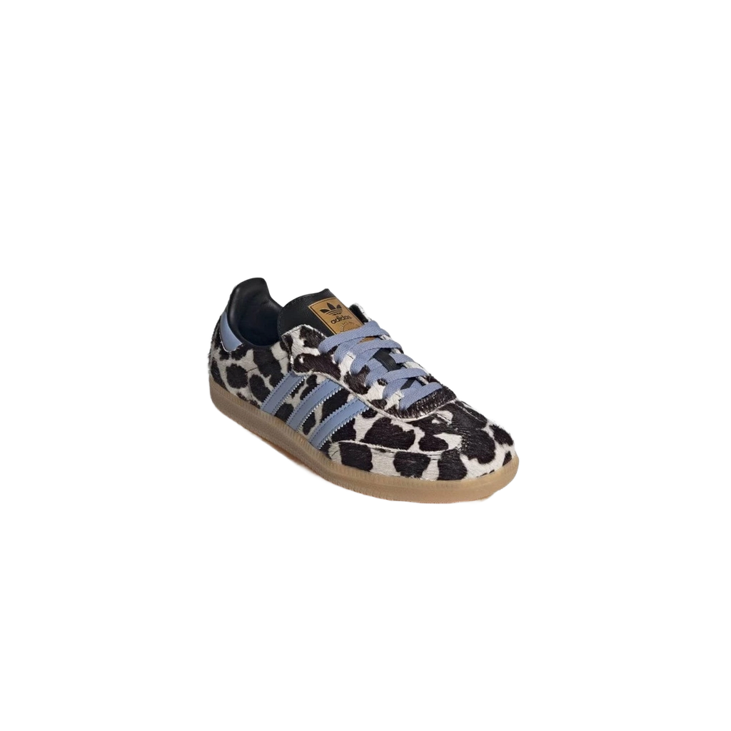 Cow-print low-top sneakers side view, light blue stripes, lace-up, gum sole