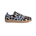 Cow-print low-top sneakers with light blue stripes, black heel, lace-up, gum sole